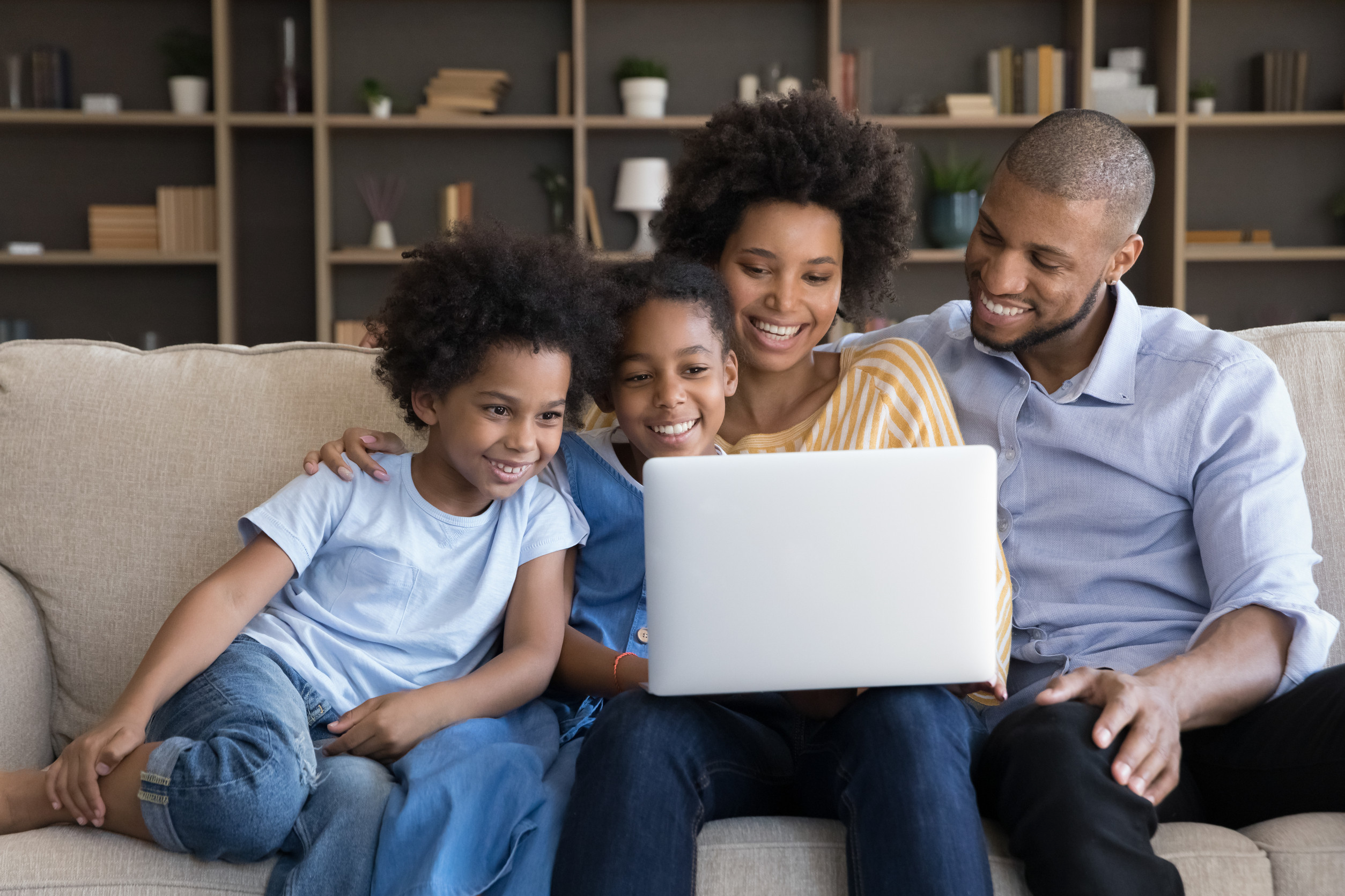 African Couple With Kids Using Laptop Together