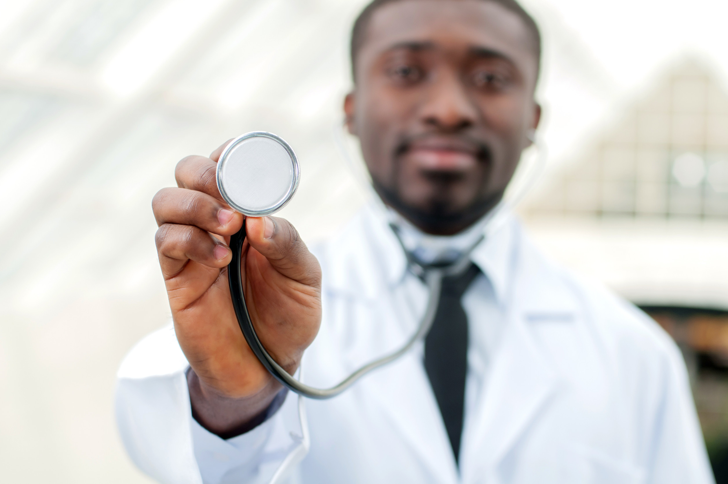 Doctor standing with a stethoscope around his neck