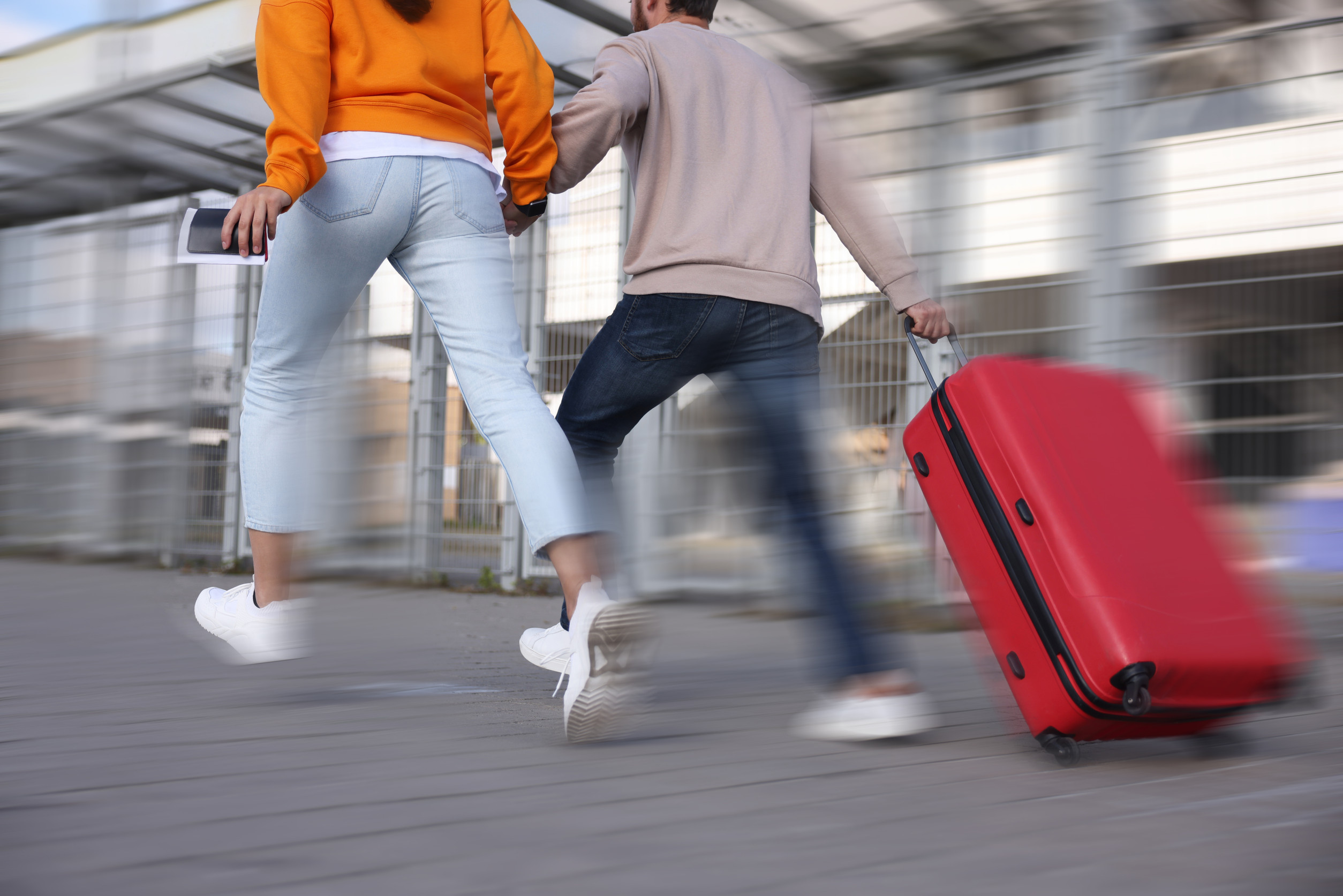 Couple running with luggage