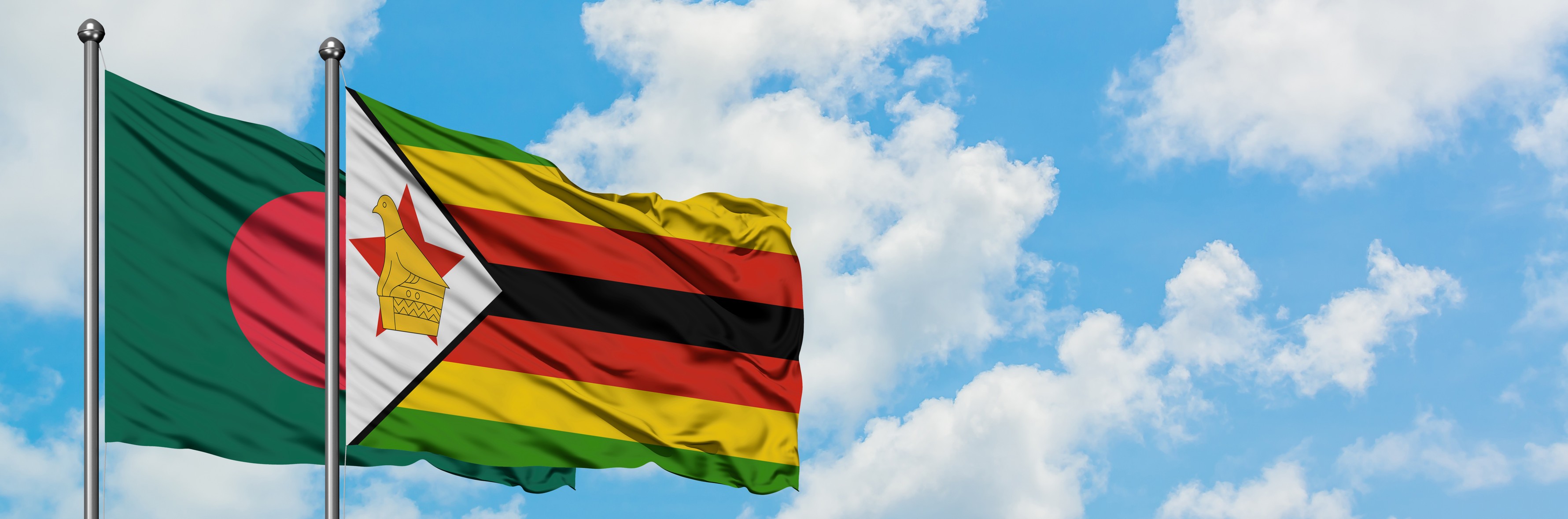 Bangladesch und Simbabwe Flaggen wehen